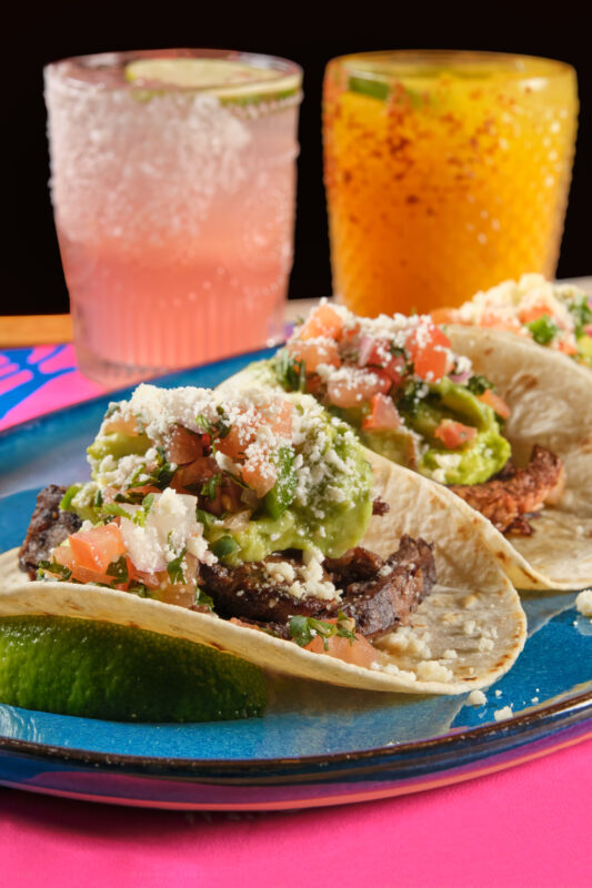 Rosa Mexicano tacos with guacamole, pico de gallo, and cotija cheese, served with frozen margaritas.