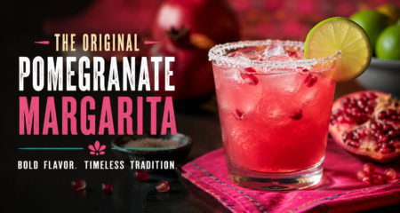 Vibrant Original Pomegranate Margarita with fresh pomegranate seeds, lime garnish, and a salted rim served at Rosa Mexicano.