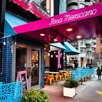 Sidwalk tables at Rosa Mexicano 44 W. 63rd Street NYC -- tables and cairs with a pink awning Rosa Mexicano