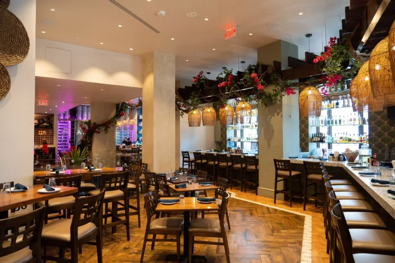 Sweeping view of Rosa Mexico interior private party room, showing tables, raised counter seating along the arc in the room
