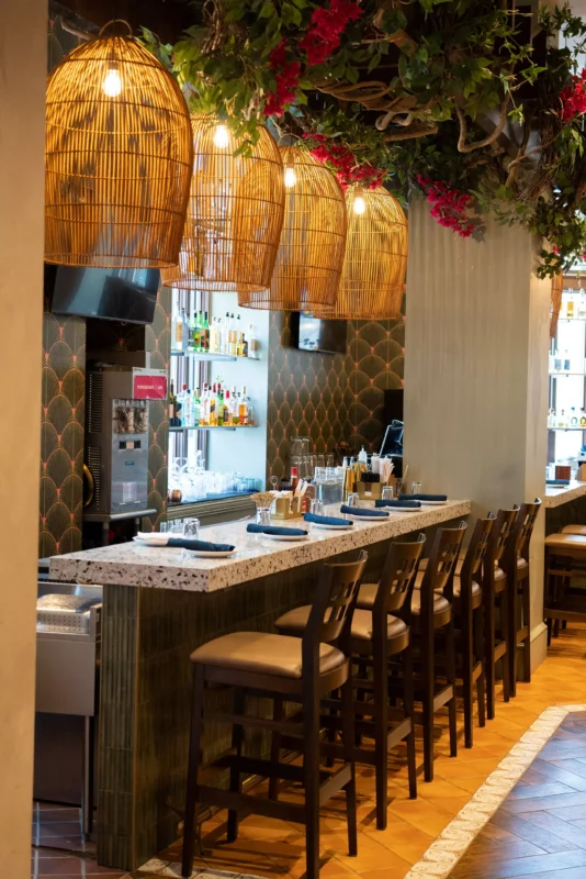 Restaurant tables and a brekfast bar and high seats in the private party room at Rosa Mexicano